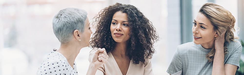 Three woman having a discussion